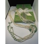 A HAND STRUNG CULTURED PEARL AND JADE LARIAT DESIGN NECKLACE LENGTH 81CM IN A PRESENTATION BOX