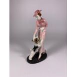 AN ART DECO PORCELAIN FIGURE OF A LADY WITH DOG, MARKED FF6 & CROWN MARK TO BASE, HEIGHT 19CM