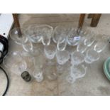 AN ASSORTMENT OF GLASS WARE TO INCLUDE WINE GLASSES, CHAMPAGNE FLUTES AND BOWLS ETC