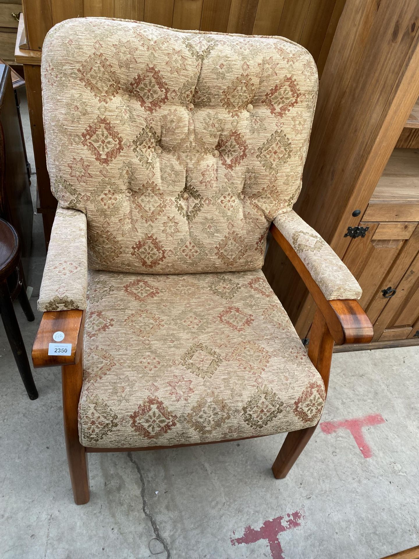 A 'YEOMAN UPHOLSTERY' FIRESIDE CHAIR