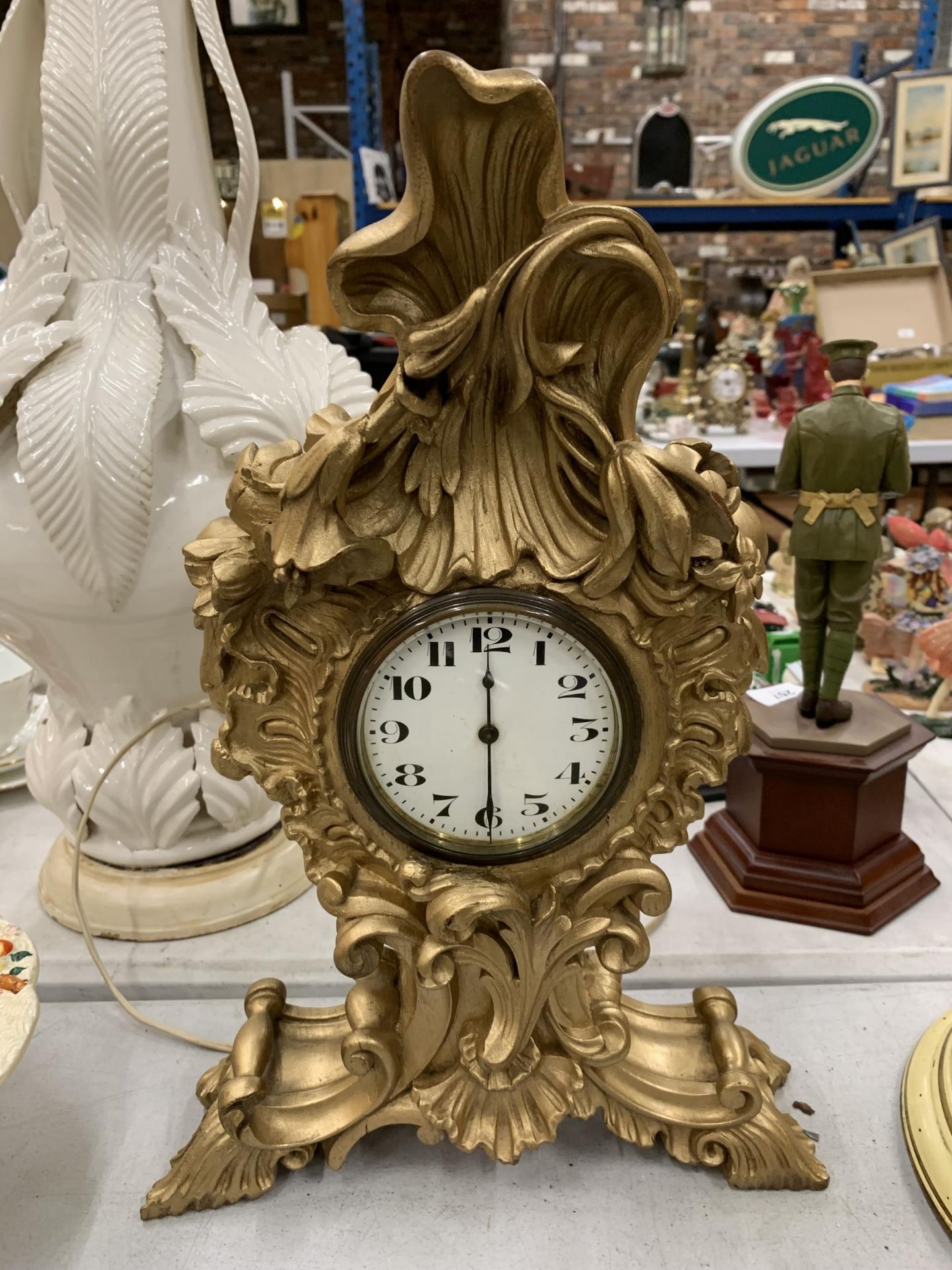 A ROCCOCO STYLE GOLD COLOURED MANTLE CLOCK HEIGHT 38CM