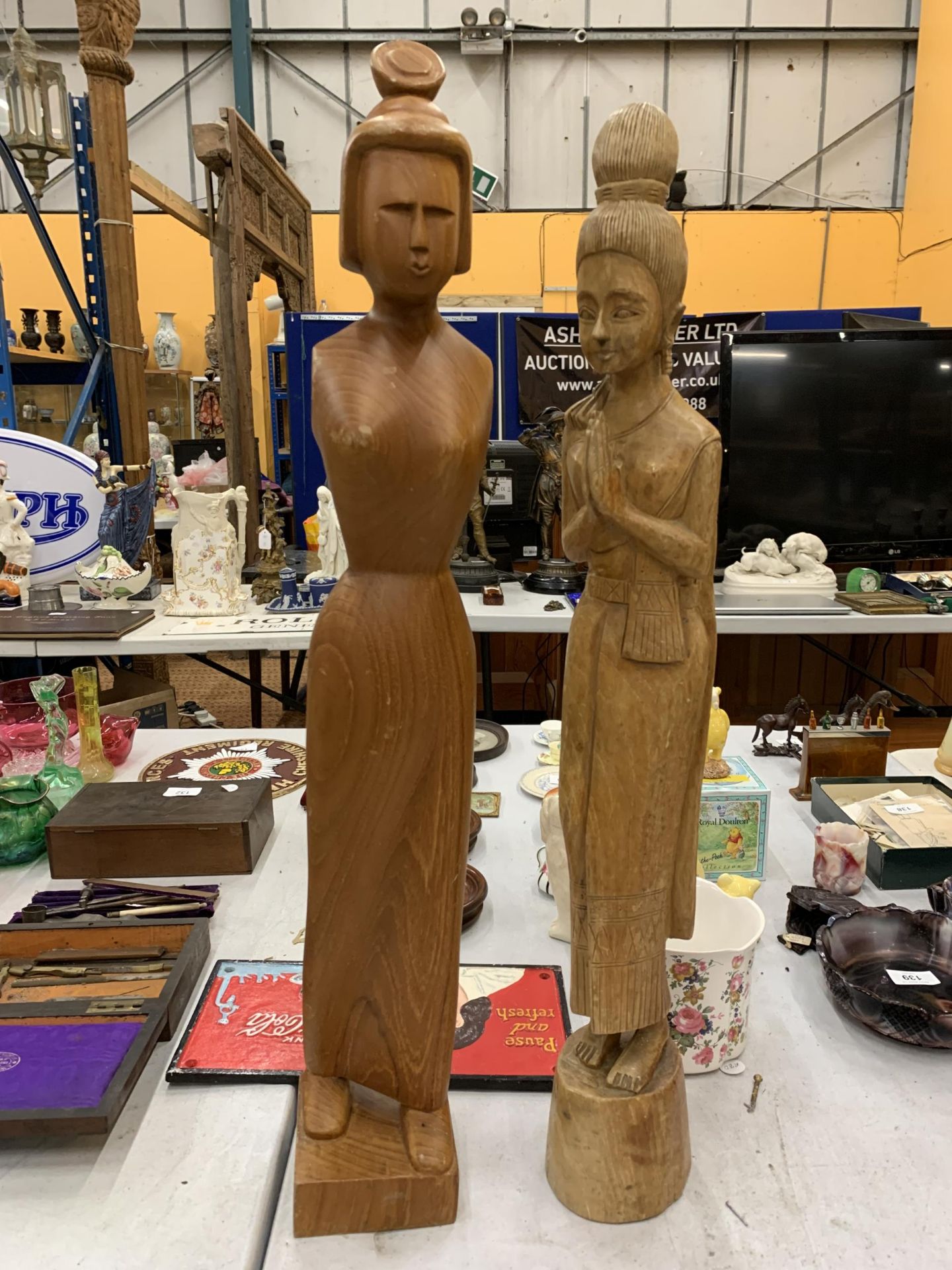 TWO HAND CARVED ORIENTAL STYLE FIGURES OF LADIES HEIGHT 64CM AND 67CM