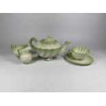 A BELLEEK CRESTED WARE CHINA FIVE PIECE TEA SET COMPRISING TEAPOT, CUP & SAUCER, CREAM JUG AND SUGAR