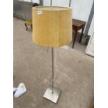 A METAL UPRIGHT FLOOR LAMP WITH SHADE