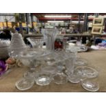 LARGE QUANTITY OF GLASSWARE TO INCLUDE VASES, CAKE STANDS ETC