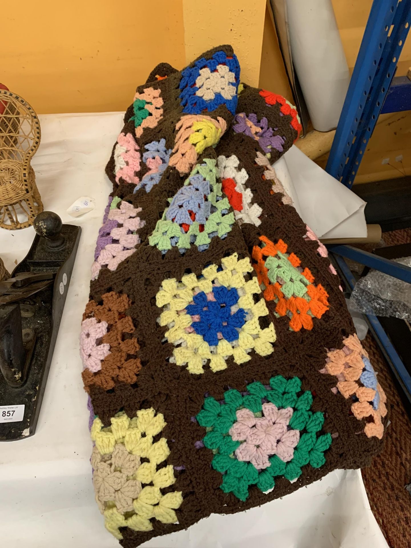 A VINTAGE CROCHETED BLANKET