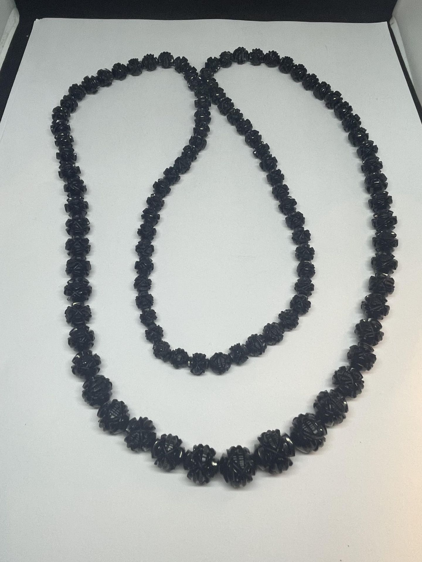 A CARVED WHITBY JET NECKLACE LENGTH 92CM