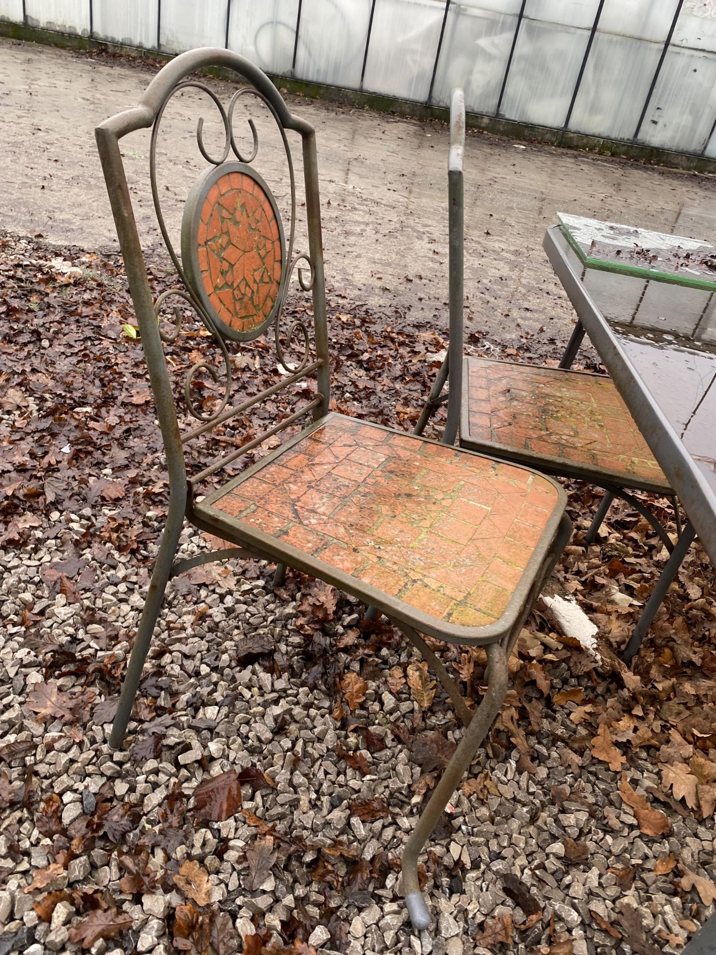 A GLASS TOPPED METAL GARDEN TABLE AND FOUR CHAIRS - Image 3 of 3