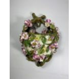 A FLORAL ENCRUSTED PORCELAIN WALL POCKET, POSSIBLY GEORGE JONES