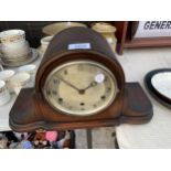 A WOODEN CASED WESTMINISTER CHIMING CLOCK WITH KEY