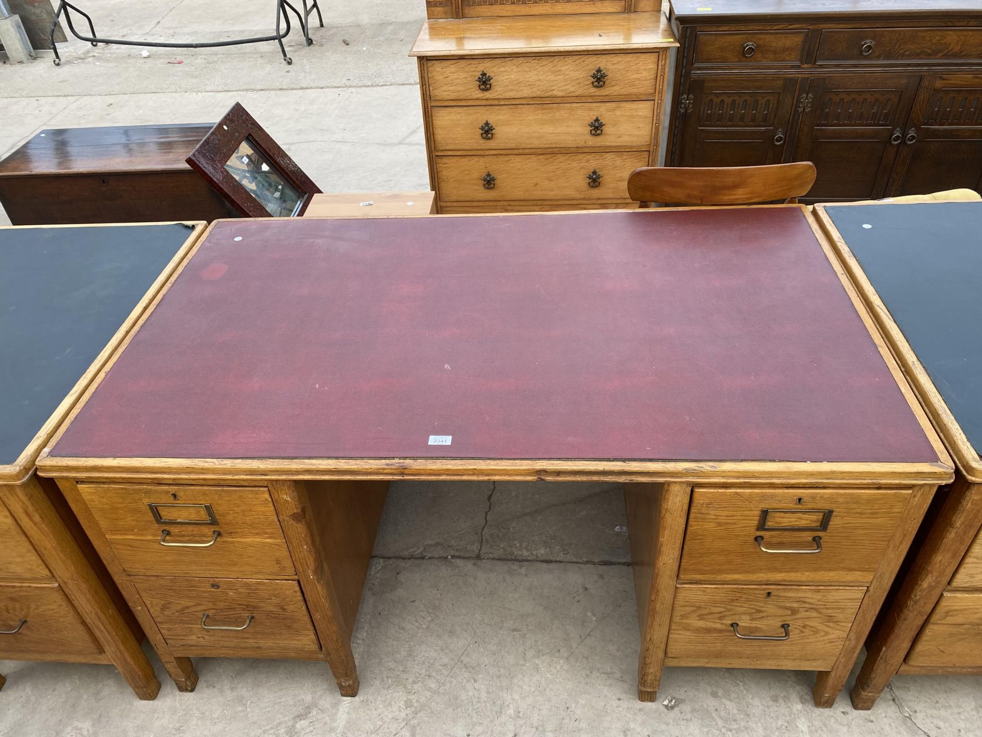 AN OAK TWIN PEDESTAL DESK WITH INSET LEATHERETTE TOP, 60X36"