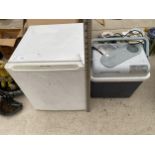 A WHITE PROLINE COUNTER TOP FRIDGE AND AN ELECTRIC COOL BOX