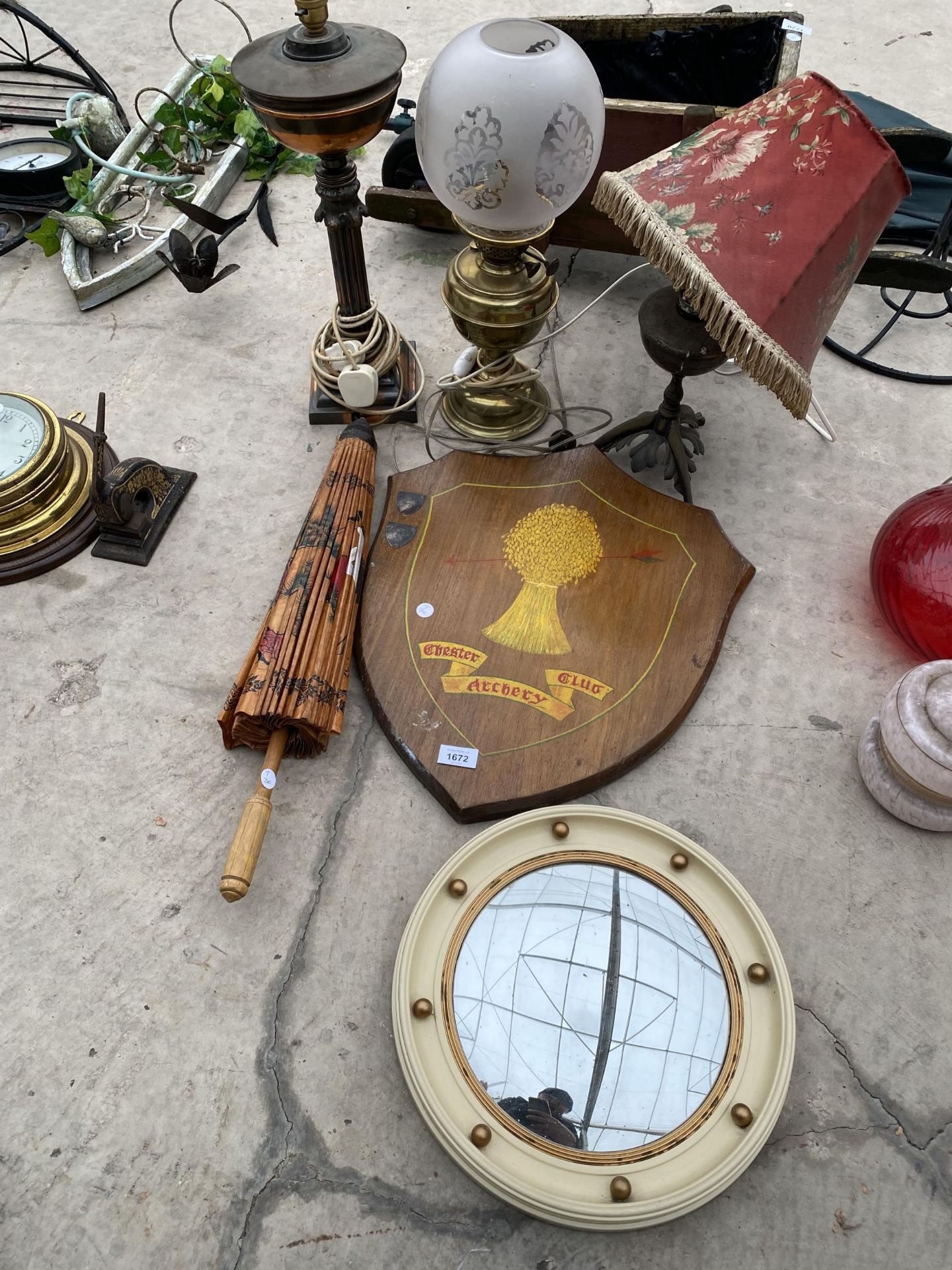 AN ASSORTMENT OF ITEMS TO INCLUDE LAMPS, A PORTHOLE STYLE MIRROR AND A VINTAGE ORIENTAL UMBRELLA ETC