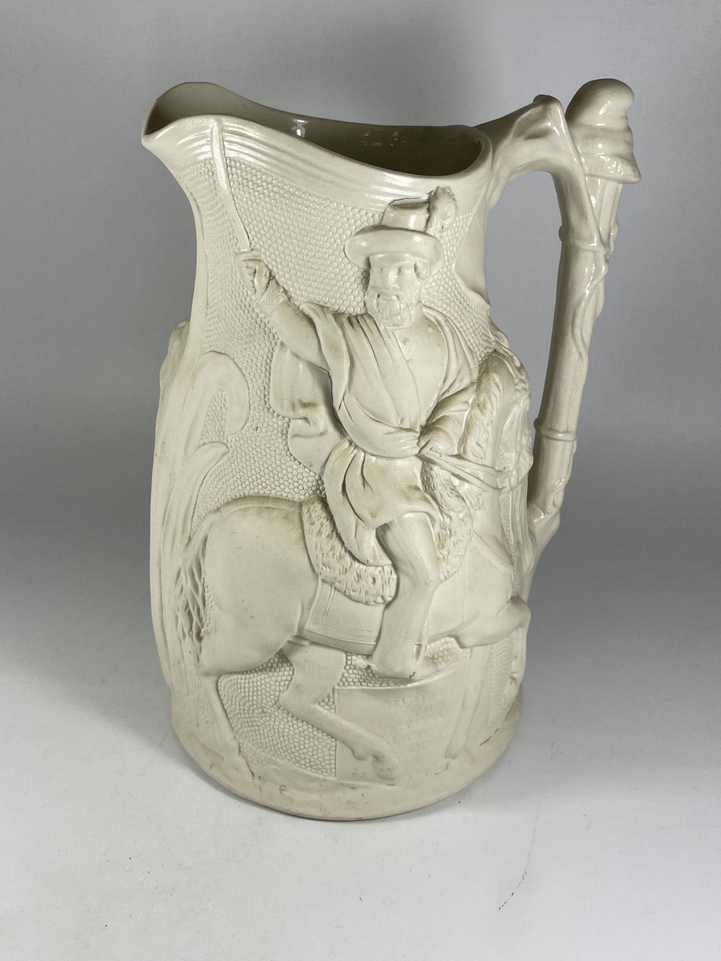 A LARGE PARIAN STYLE POTTERY JUG OF A MAN ON HORSEBACK, HEIGHT 31CM