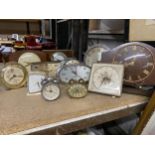 A LARGE QUANTITY OF VINTAGE MANTLE CLOCKS TO INCLUDE PETIT POINT, SMITHS, ALARM CLOCKS, ETC