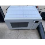 A WHITE KENWOOD MICROWAVE OVEN