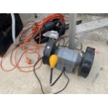 A TITAN BENCH GRINDER AND A BLACK AND DECKER ELECTRIC SAW