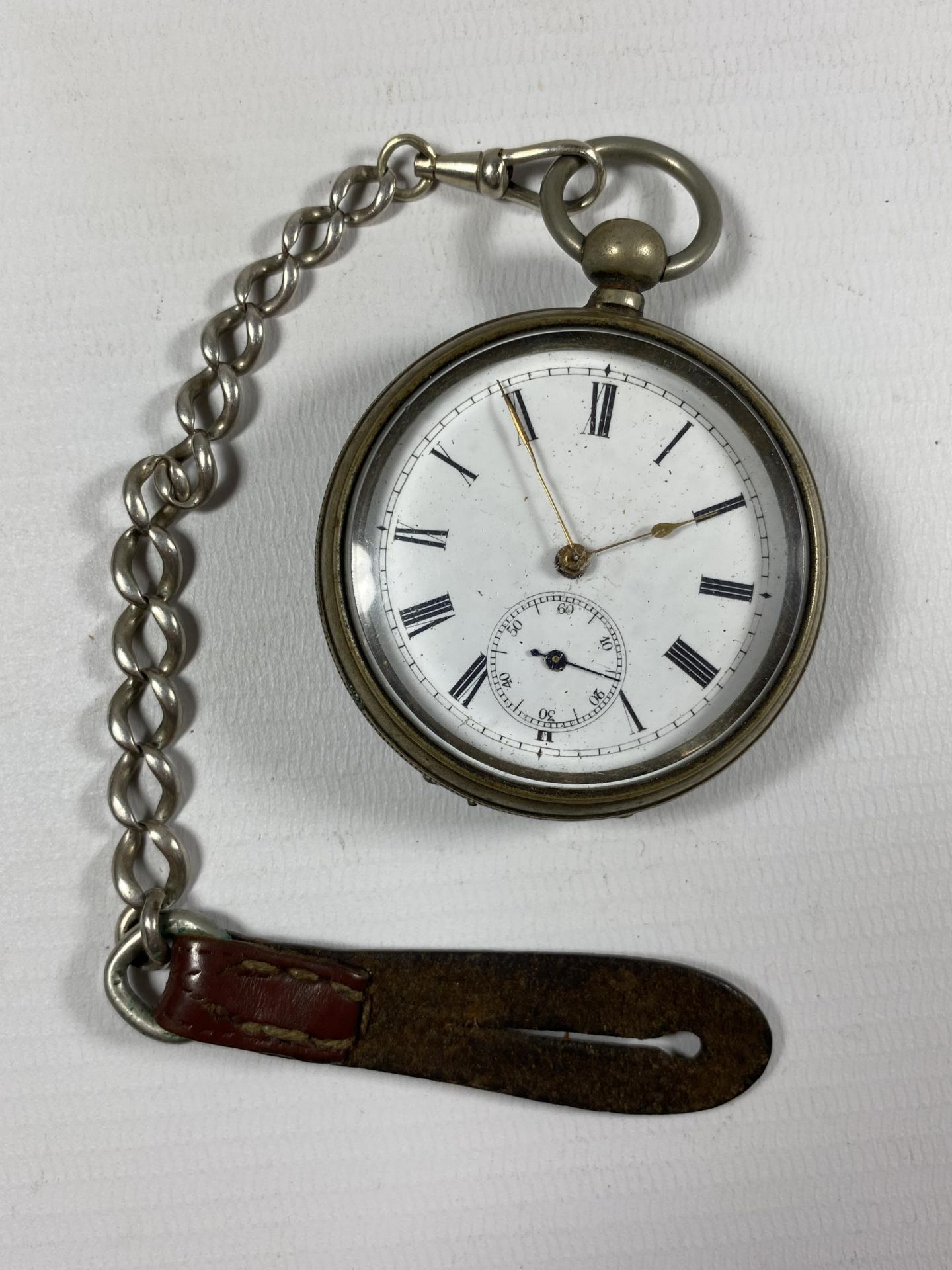 A .935 SILVER OPEN FACED POCKET WATCH WITH PLATED ALBERT CHAIN AND HALLMARKED SILVER FOB