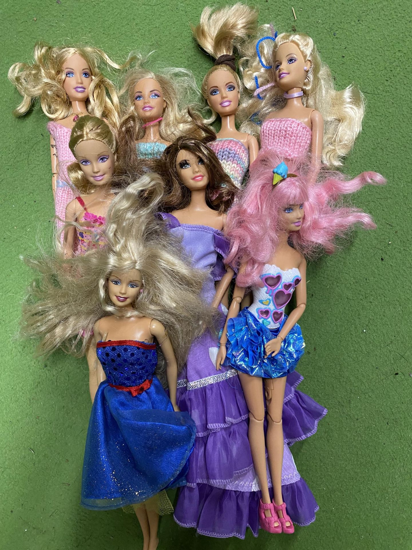 A BAG OF EIGHT MATTEL DOLL FIGURES