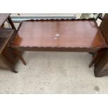 A MODERN MAHOGANY GALLERY TOP COFFEE TABLE WITH TWO END SLIDES, 39X20"