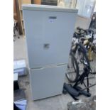 A WHITE FRIGIDAIRE UPRIGHT FRIDGE FREEZER