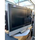 A PANASONIC 26" TELEVISION WITH REMOTE CONTROL