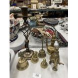 A QUANTITY OF BRASSWARE TO INCLUDE A CANDLESTICK, FIGURES, BELL, AFTABA WATER PITCHER, ETC.,