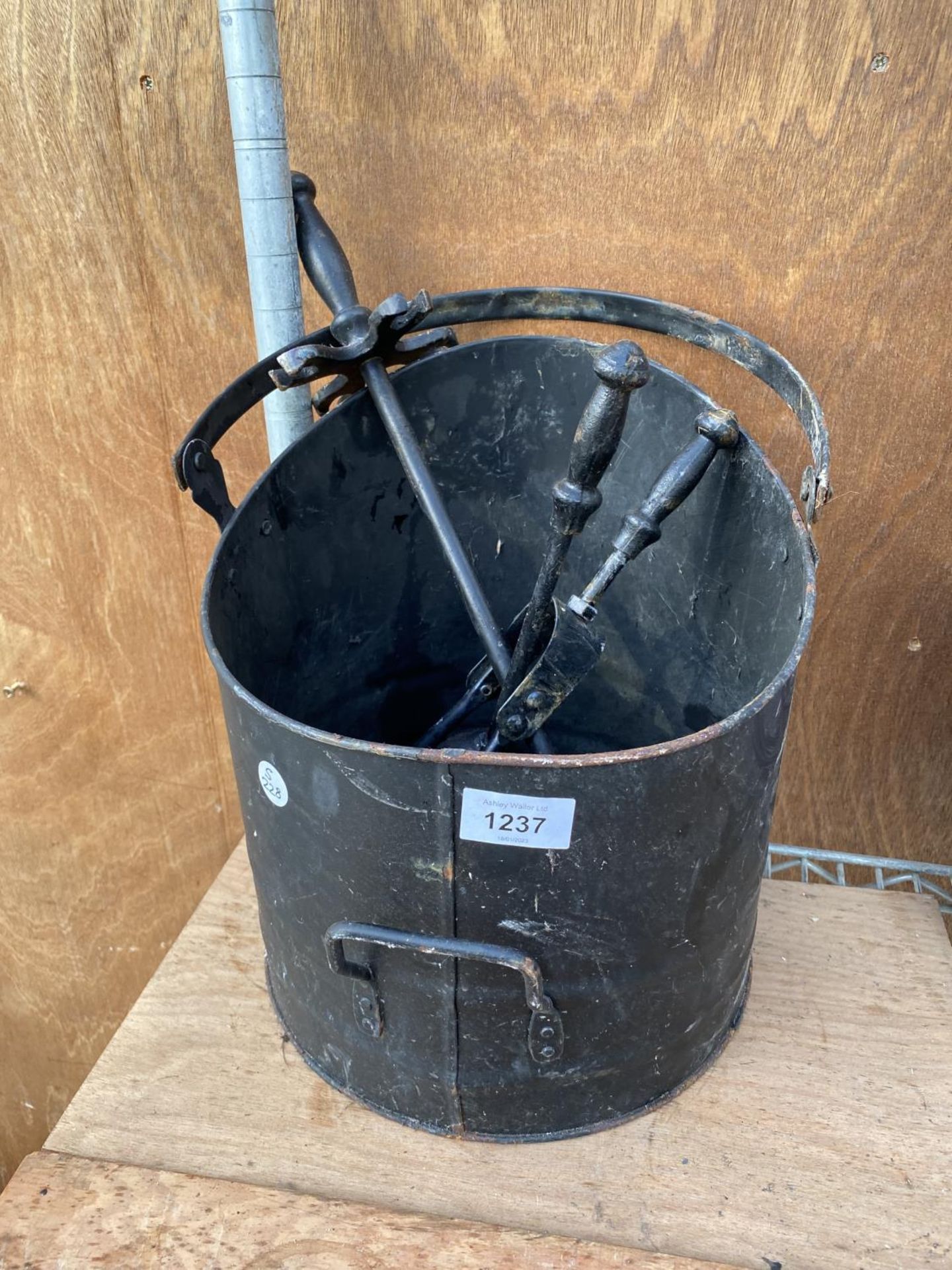 A BLACK METAL COAL BUCKET AND THREE FIRESIDE COMPNAION ITEMS