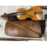 A VINTAGE VIOLIN AND BOW IN LEATHER CARRY CASE