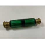 A VINTAGE GREEN GLASS AND BRASS TOPPED DOUBLE SIDED PERFUME BOTTLE