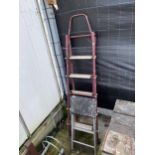 A TUBULAR METAL STEP LADDER AND A KITCHEN STEP STOOL