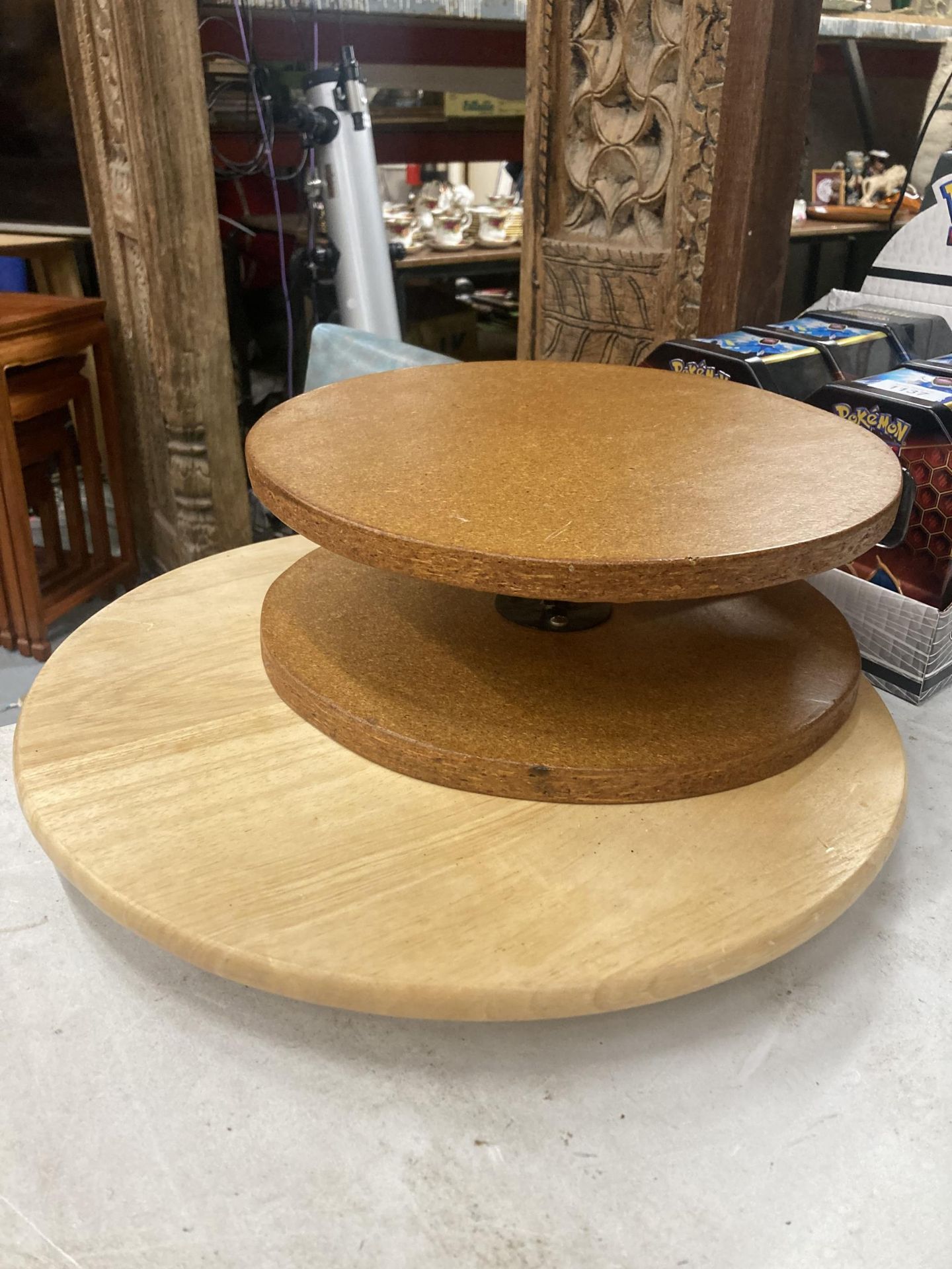 TWO WOODEN TURN TABLES POSSIBLY FOR CAKE DECORATING