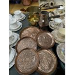 A COLLECTION OF BRASS WALL PLAQUES WITH TWO COPPER PANS AND JUG