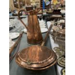 A COPPER BED WARMER TOGETHER WITH A LARGE COPPER HOT WATER JUG