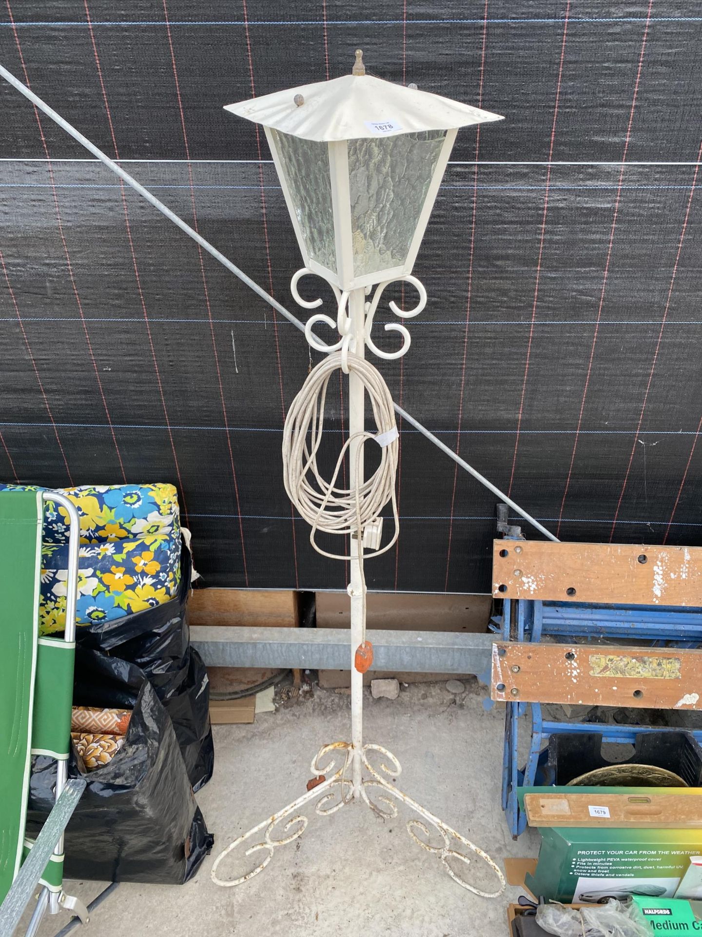 A DECORATIVE METAL FLOOR LAMP