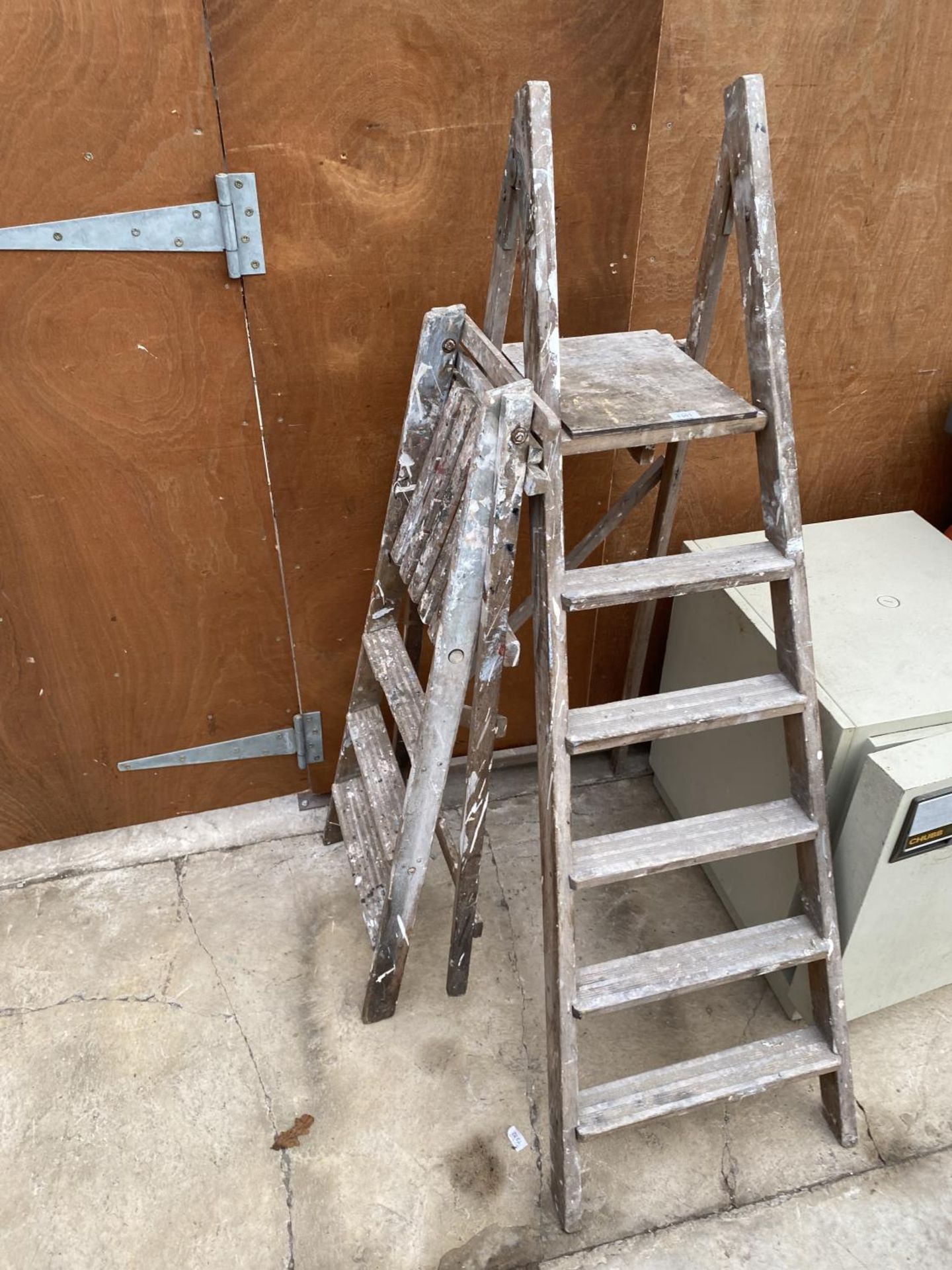 TWO VINTAGE WOODEN STEP LADDERS TO INCLUDE A FIVE RUNG AND A THREE RUNG