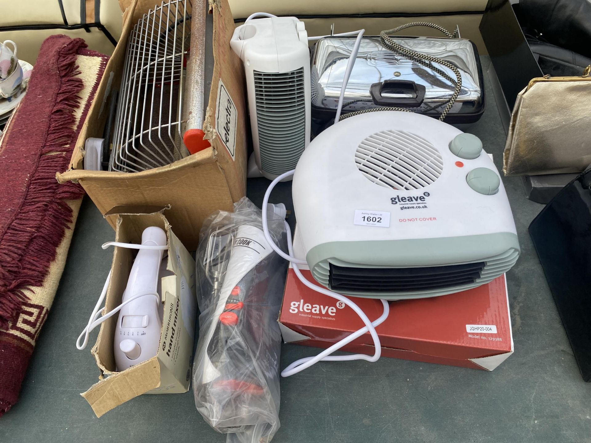 AN ASSORTMENT OF ITEMS TO INCLUDE HEATERS, A HAND MIXER AND WAFFLE MAKER ETC