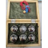 A BOXED SET OF CARPET BOULES