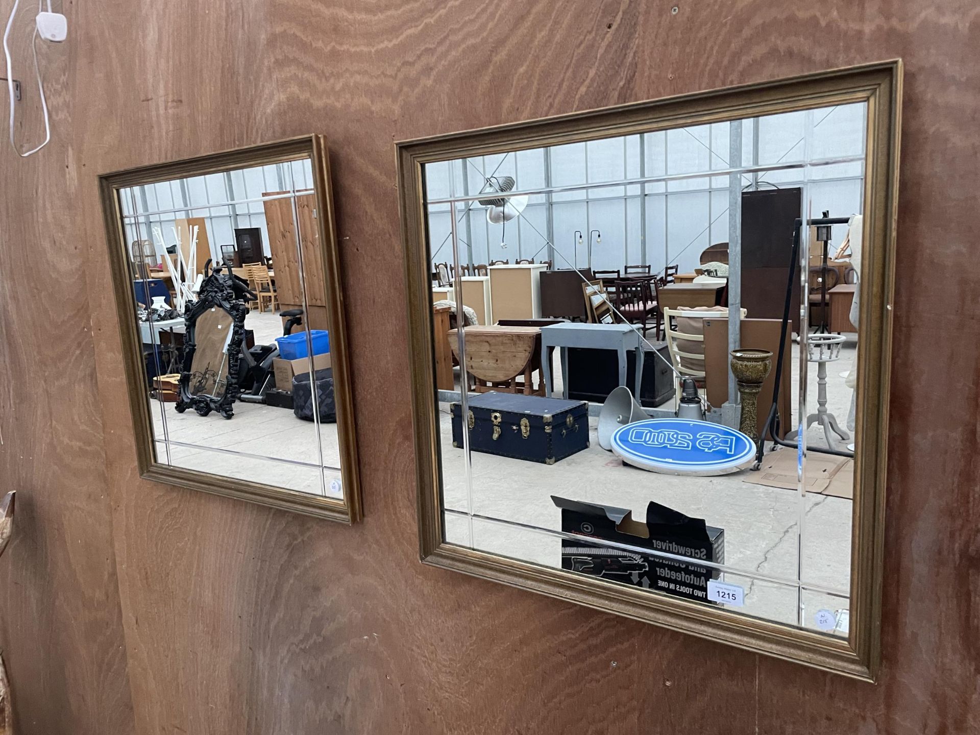 A PAIR OF WOODEN FRAMED WALL MIRRORS WITH ETTCHED DETAIL