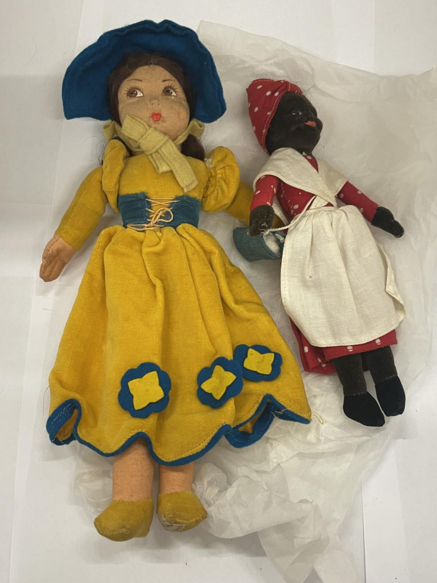 TWO VINTAGE NORAH WELLINGS CLOTH DOLLS WITH LABELS TO FEET TO INCLUDE ONE IN A YELLOW DRESS AND A