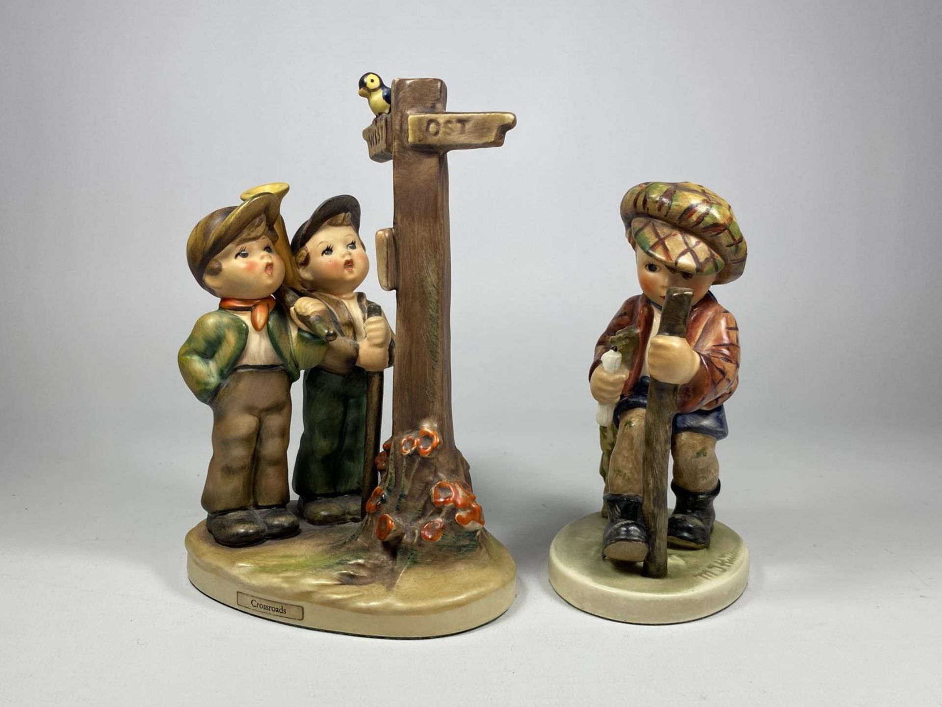 TWO VINTAGE HUMMEL FIGURES TO INCLUDE 'CROSSROADS'