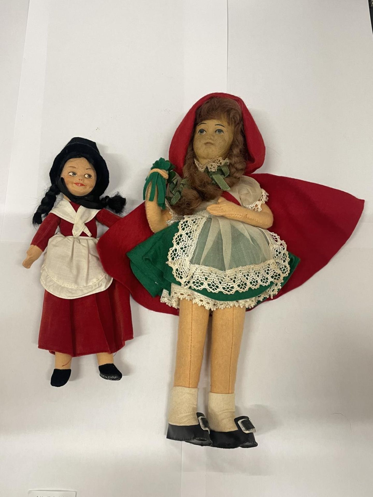 A NORAH WELLINGS VINTAGE CLOTH WELSH STYLE DOLL WITH LABEL TO FOOT AND A NORAH WELLINGS STYLE RED