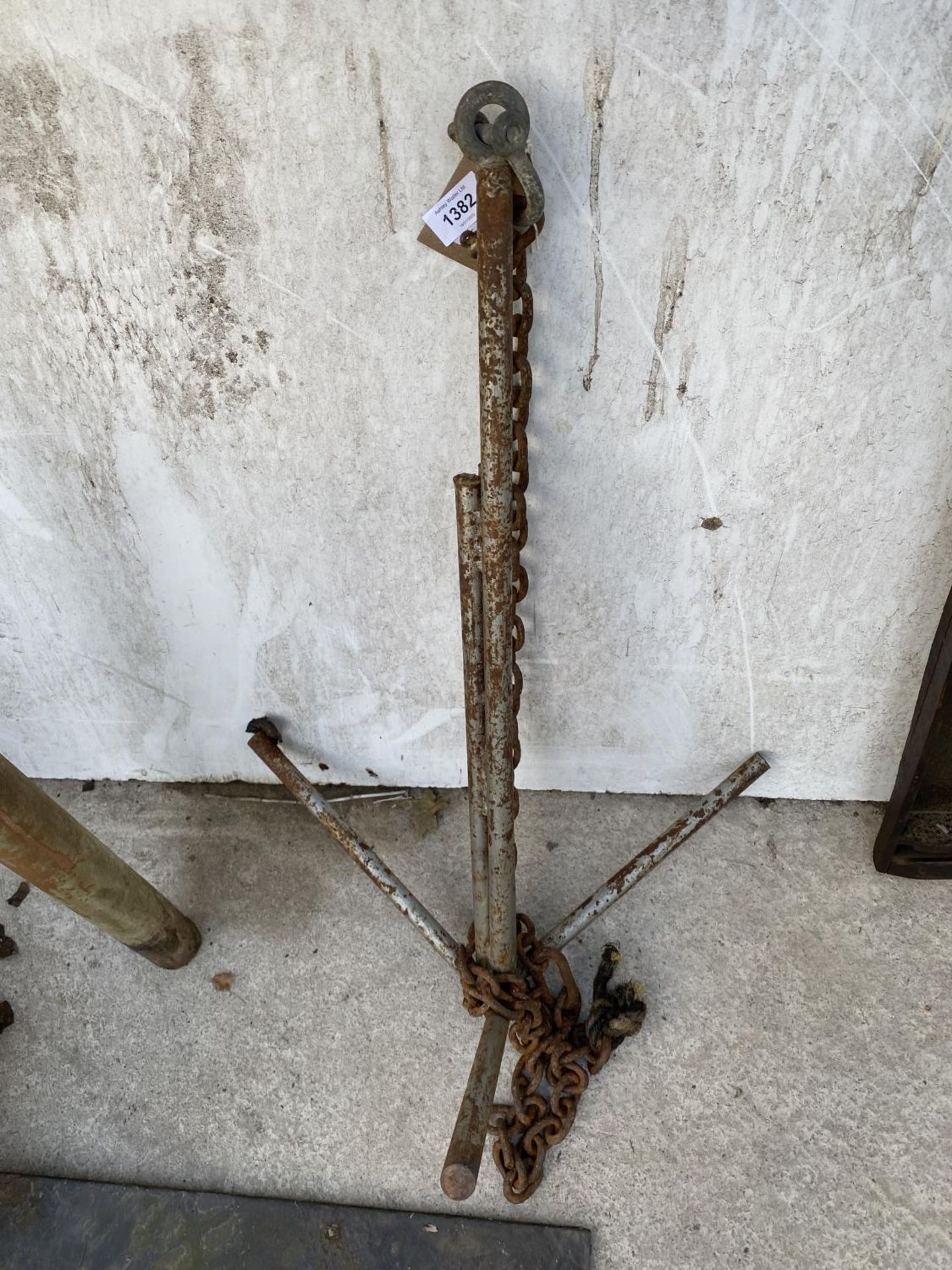 A METAL BOAT ANCHOR WITH CHAIN