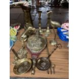 A QUANTITY OF BRASSWARE TO INCLUDE A JUG, CANDLESTICKS, STORK, DOG, ETC.,