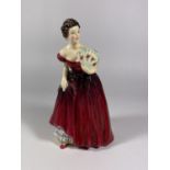 A RADNOR CERAMIC LADY FIGURE IN RED DRESS