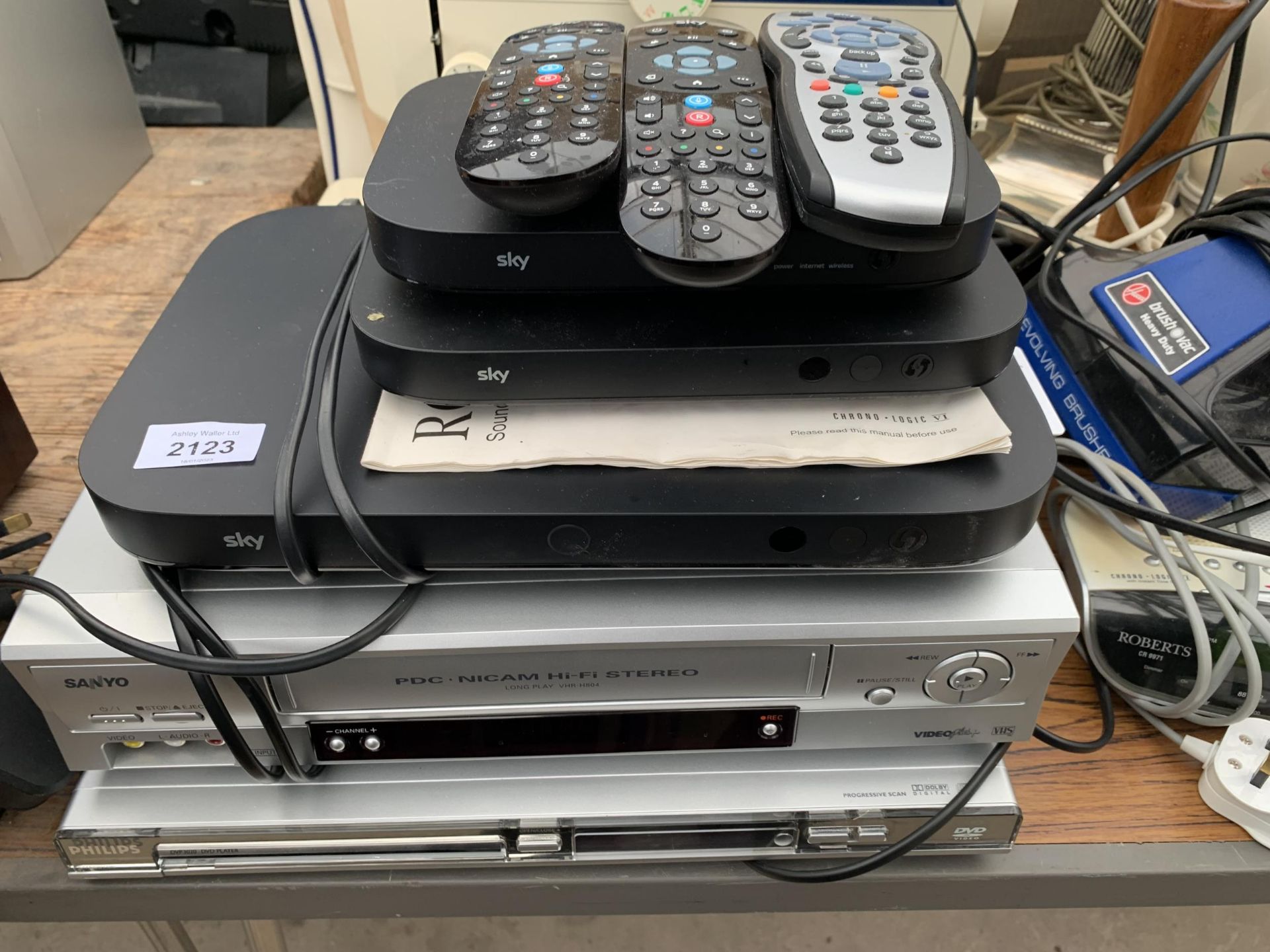 AN ASSORTMENT OF ITEMS TO INCLUDE A SANYO VHS PLAYER, A PHILIPS DVD PLAYER AND REMOTE CONTROLS ETC