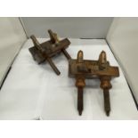 AN ANTIQUE FRUITWOOD PLOUGH PLANE TOGETHER WITH A THUMB SCREW PLOUGH