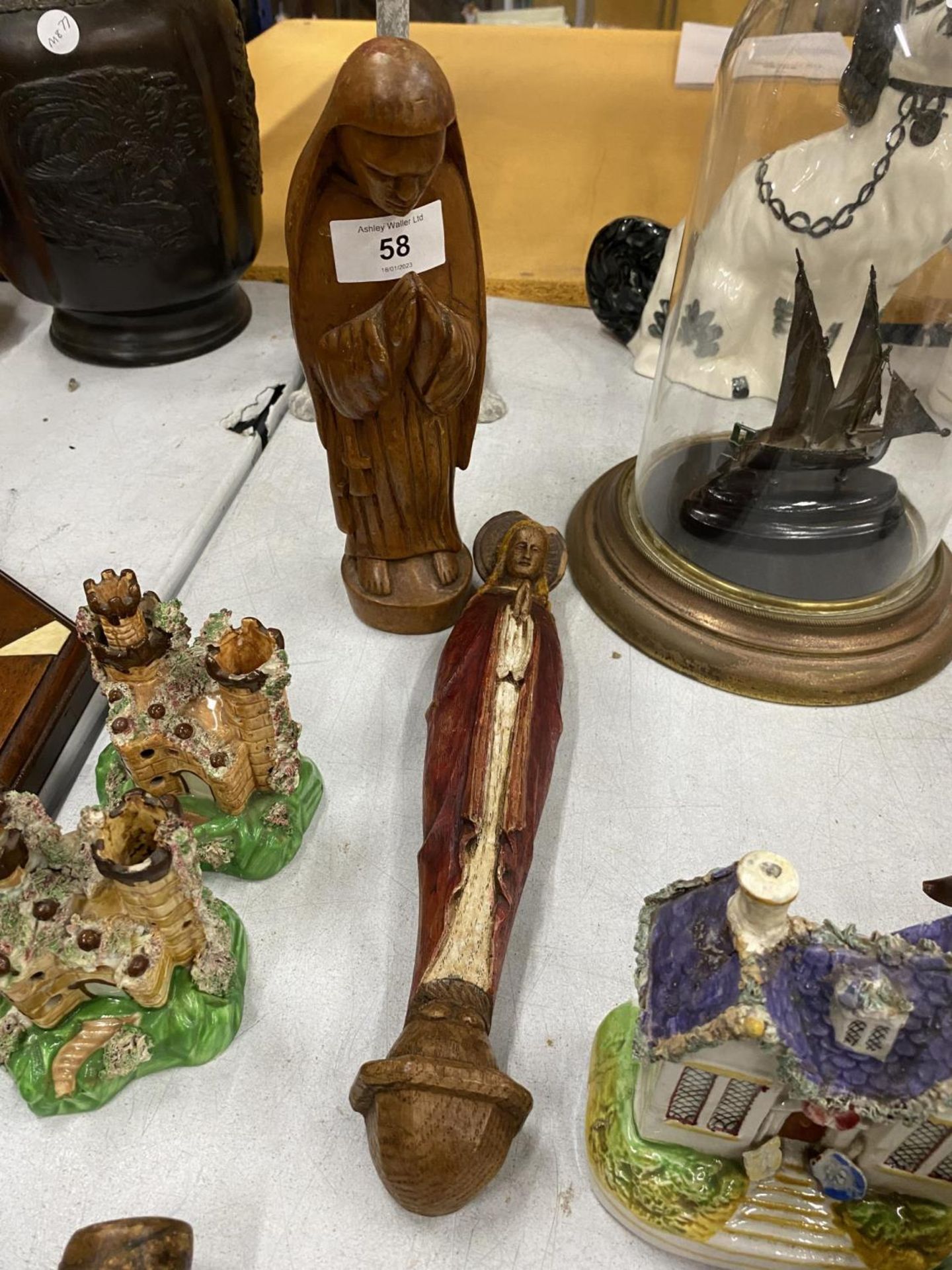 TWO RELIGIOUS CARVED WOODEN ITEMS - PRAYING MAN & JESUS MODEL