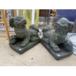 A PAIR OF RECONSTITUTED STONE ORIENTAL STYLE LIONS