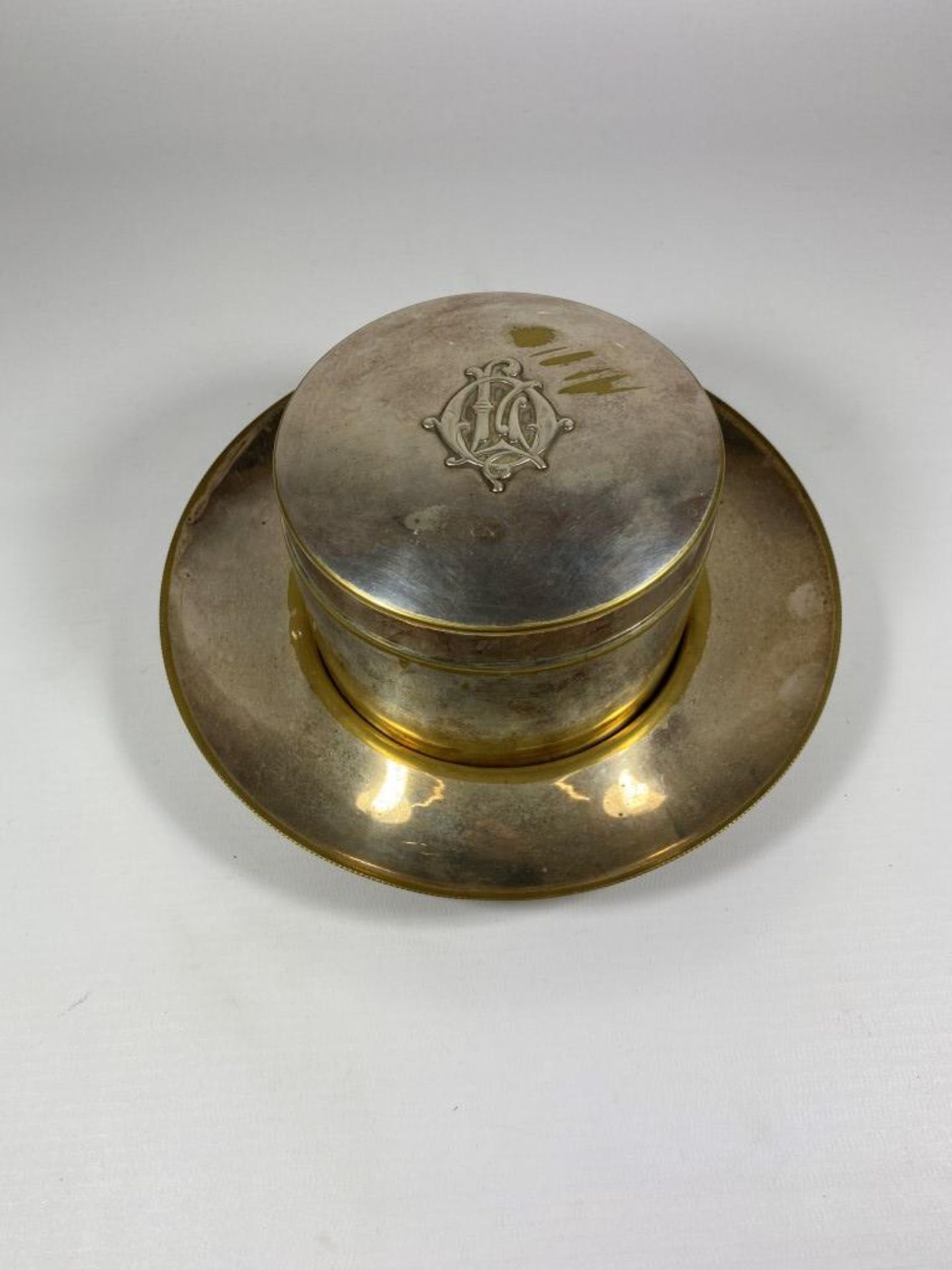 A VINTAGE SILVER PLATED LARGE LIDDED POT ON A DISH